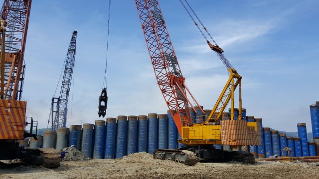 Excavation inside tubular piles using grab hammer